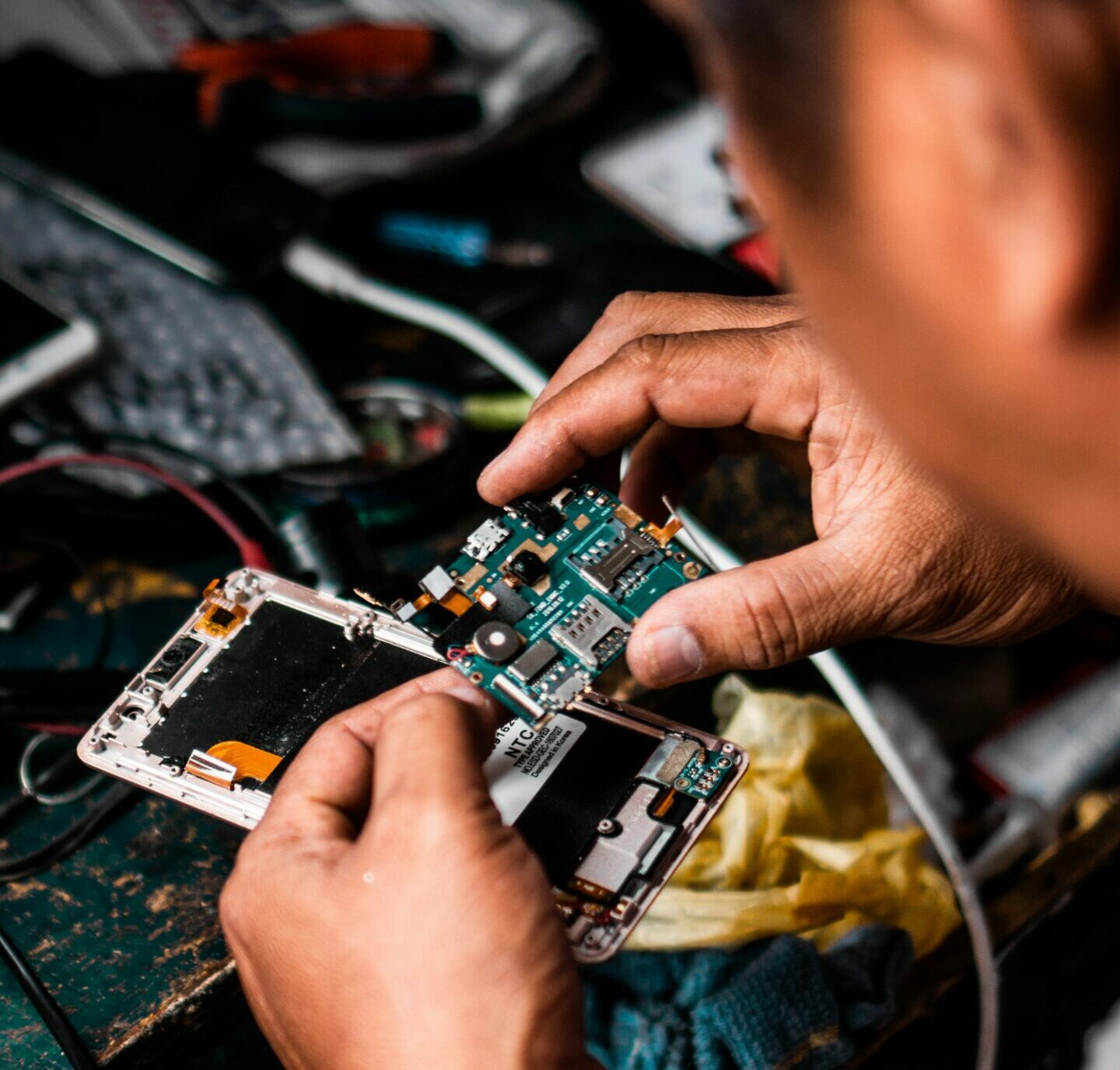 Man Repairing Android Smartphone