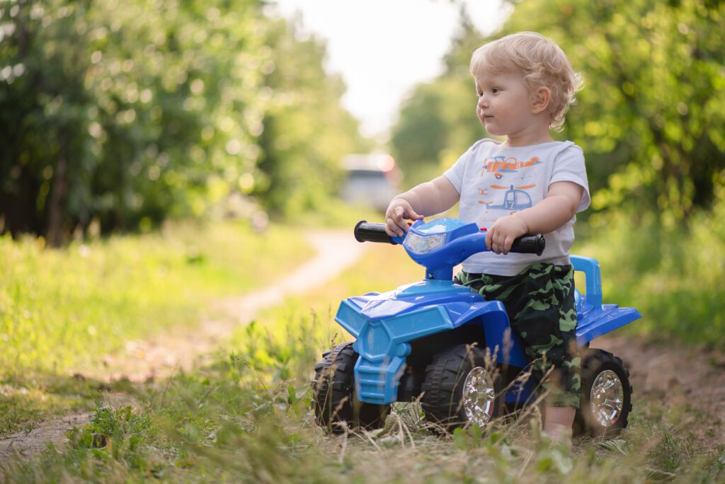 Boy Riding on Car